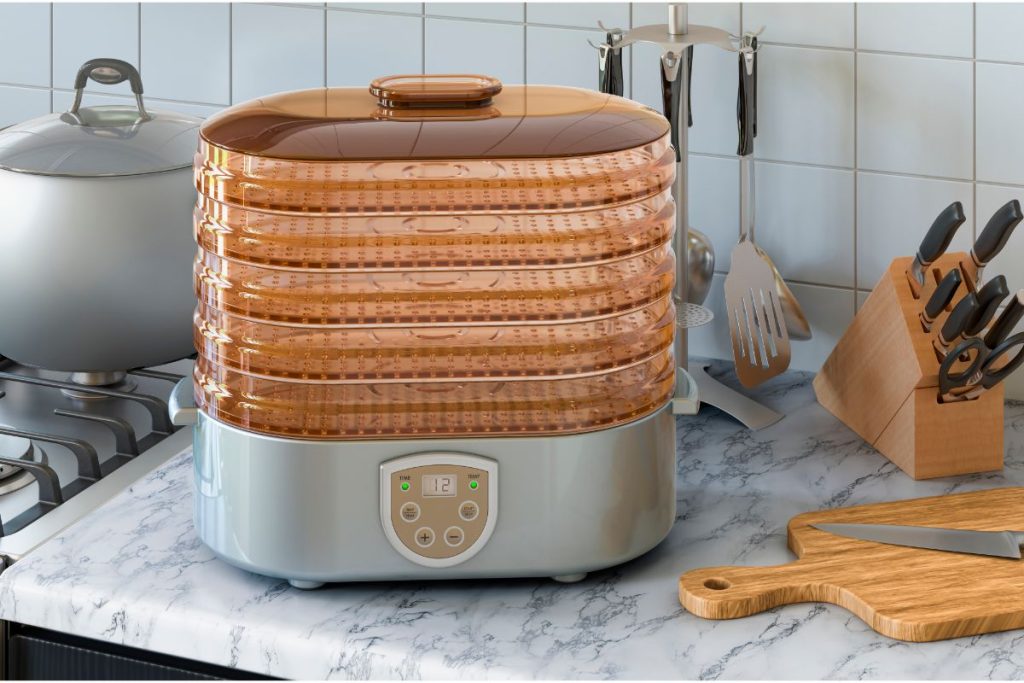 Electric food dehydrator in kitchen sitting on the counter.