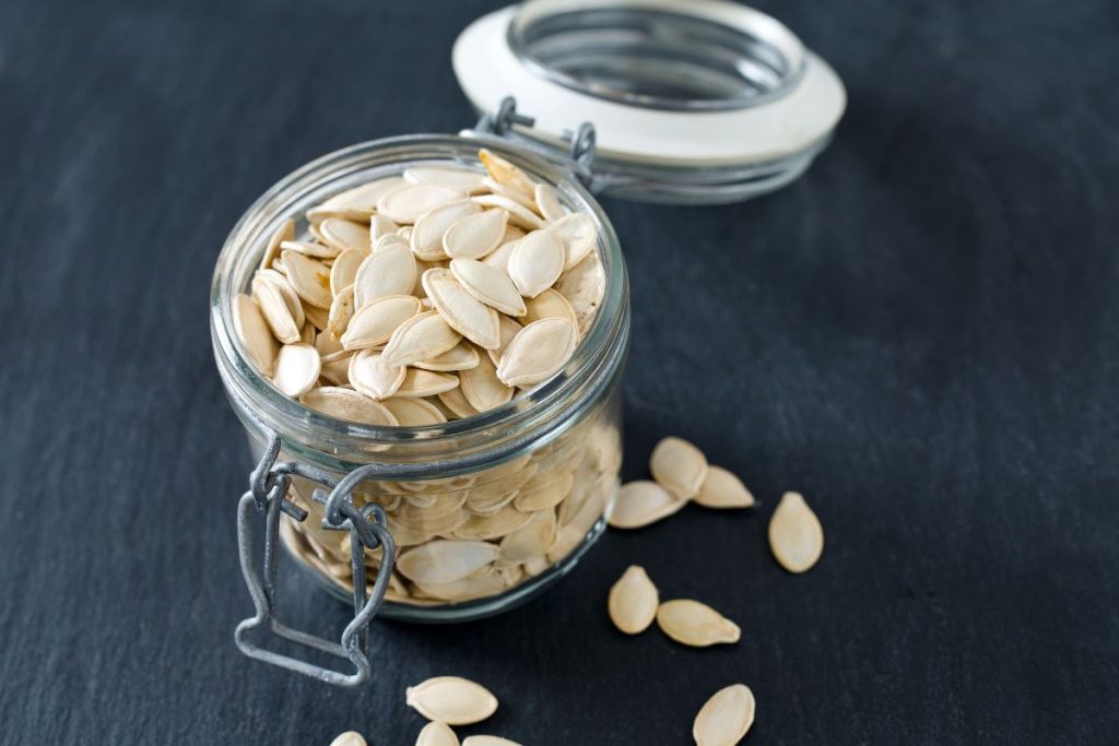 Pumpkin seeds inside glass container