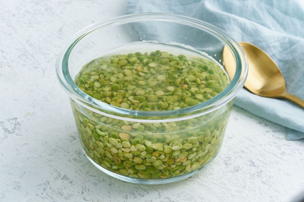 Bowl of water filled with dried peas