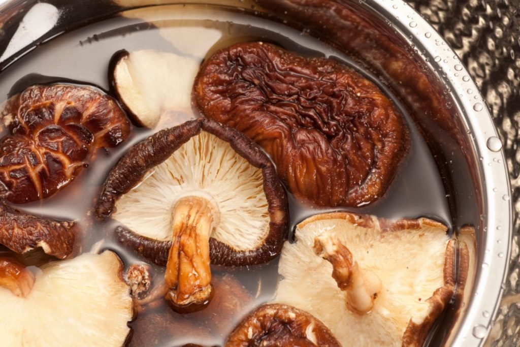 Shiitake mushrooms in bowl of water