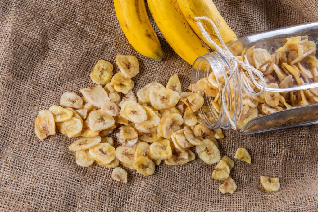 Dried banana chips in container