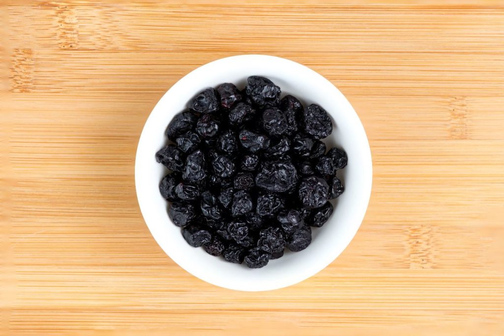 Bowl of dried blueberries on a table