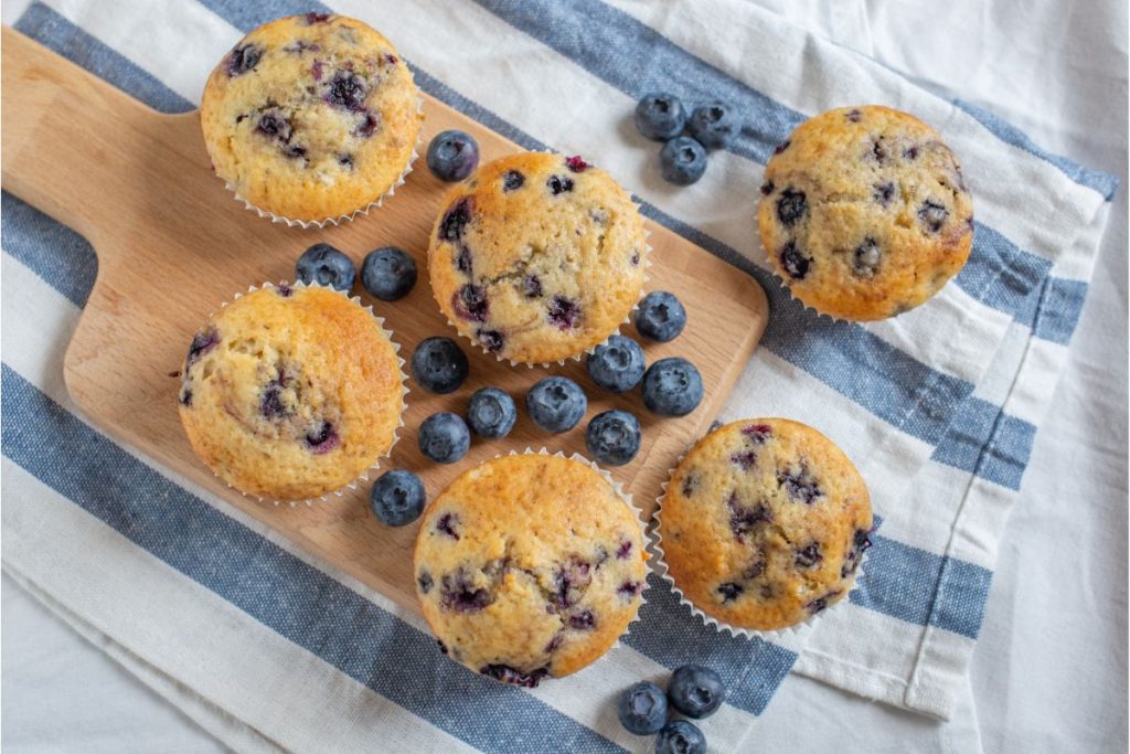Blueberry muffins on a cutting board