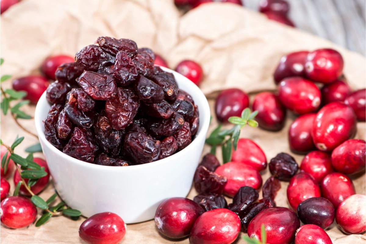 Dried cranberries and fresh cranberries on a table