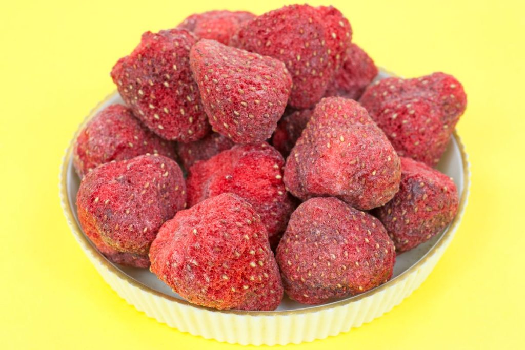 Plate with whole freeze-dried strawberries