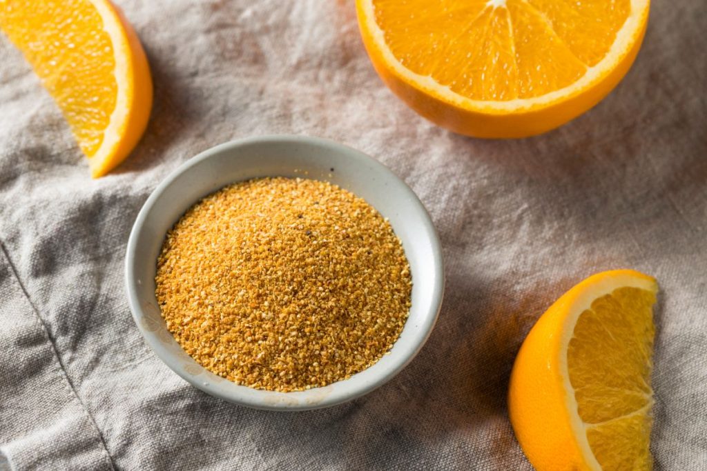 bowl of orange zest that has been powdered and dried