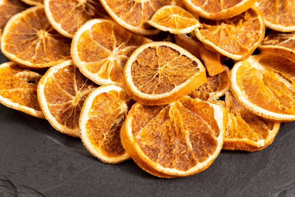 Dark colored dried orange slices ,ade in an oven