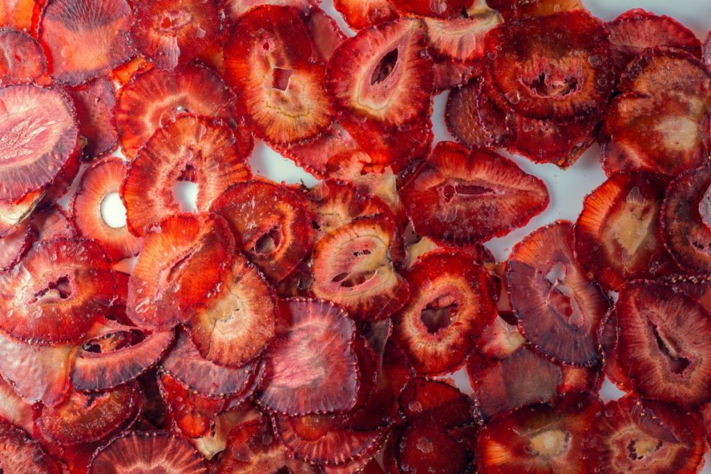 sun-dried strawberry chips on white background
