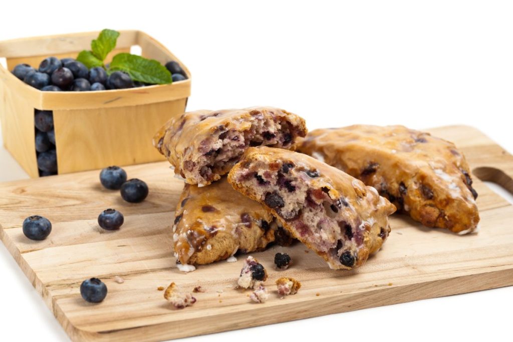 Scones on a cutting board made with dried blueberries