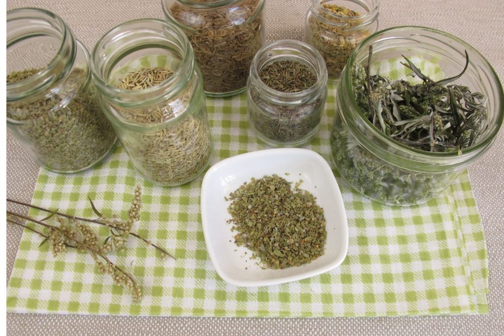 Storing dried herbs in glass canisters with airtight seals