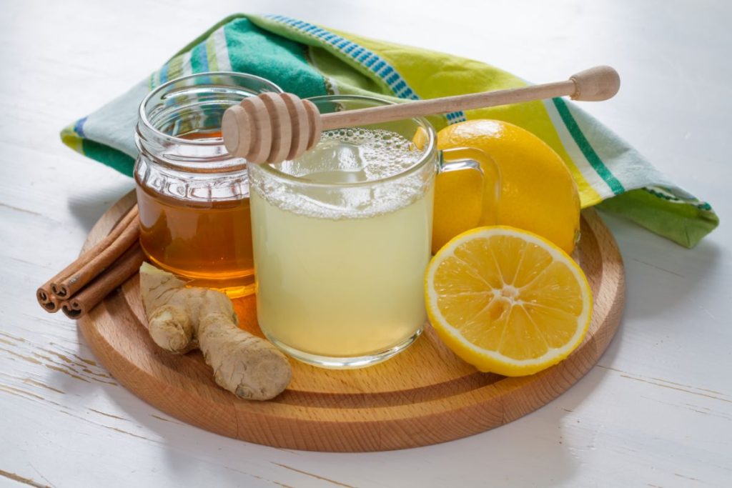 Ginger tea ingredients including ginger lemon honey and cinnamon