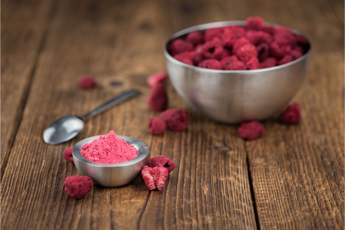 Dried raspberry powder and a bowl of dried raspberries