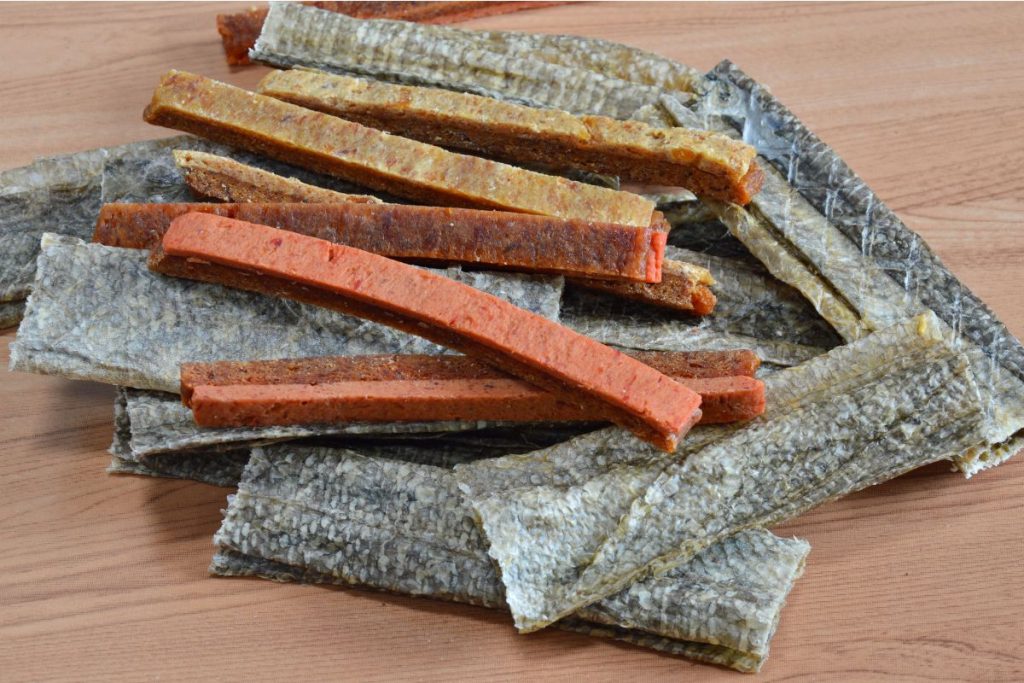Strips of dried fish and fish skin on a table