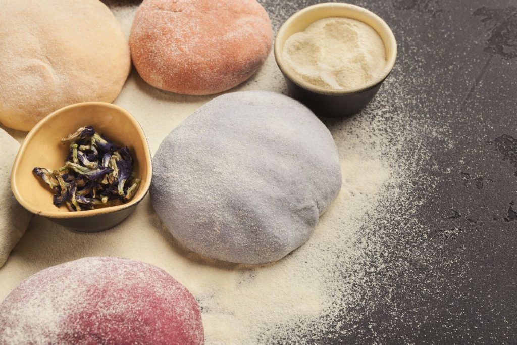 Fruit powder mixed into dough balls to form different color balls of dough