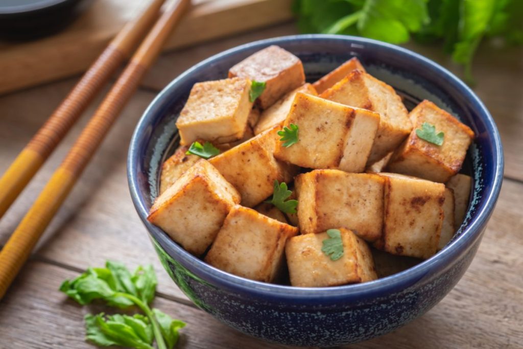 Fried tofu chunks in blue bowl