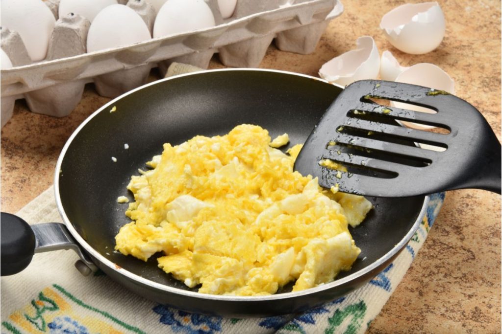 Frying pan full of scrambled eggs